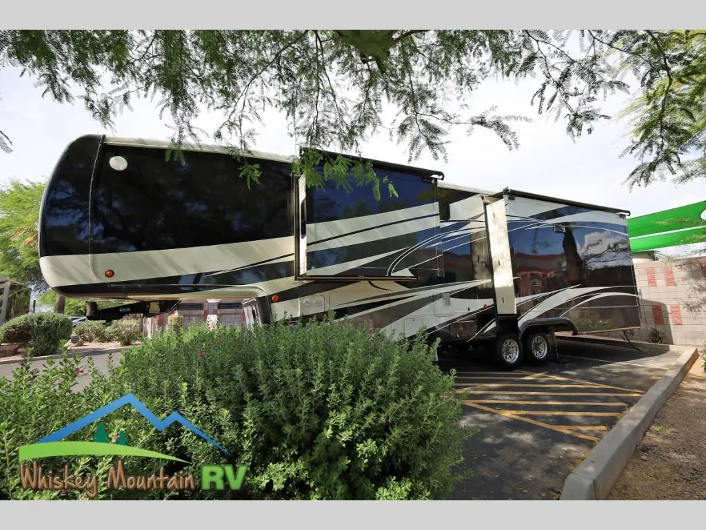 A large rv parked on the side of a road.