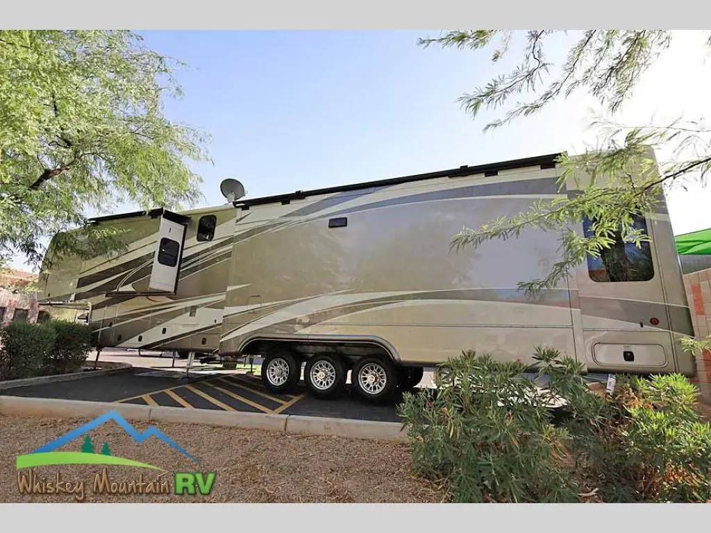 A large rv parked on the side of a road.